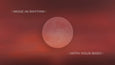 A large, pale moon against a deep red gradient sky, with the text 